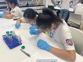 Participants testing samples during the Practicum Session