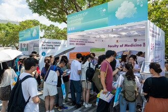 Visitors coming to the Faculty booth